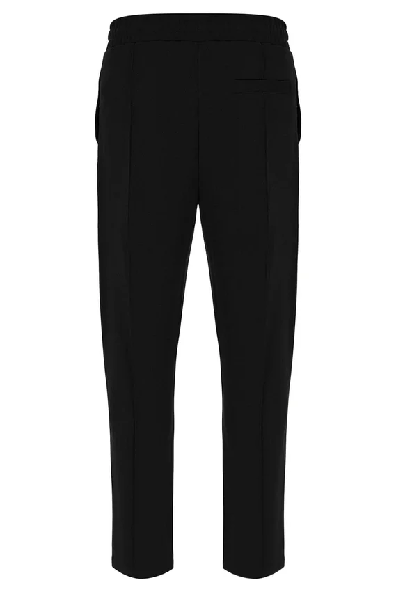 Pantalon slim noir Molveno à plis creusés